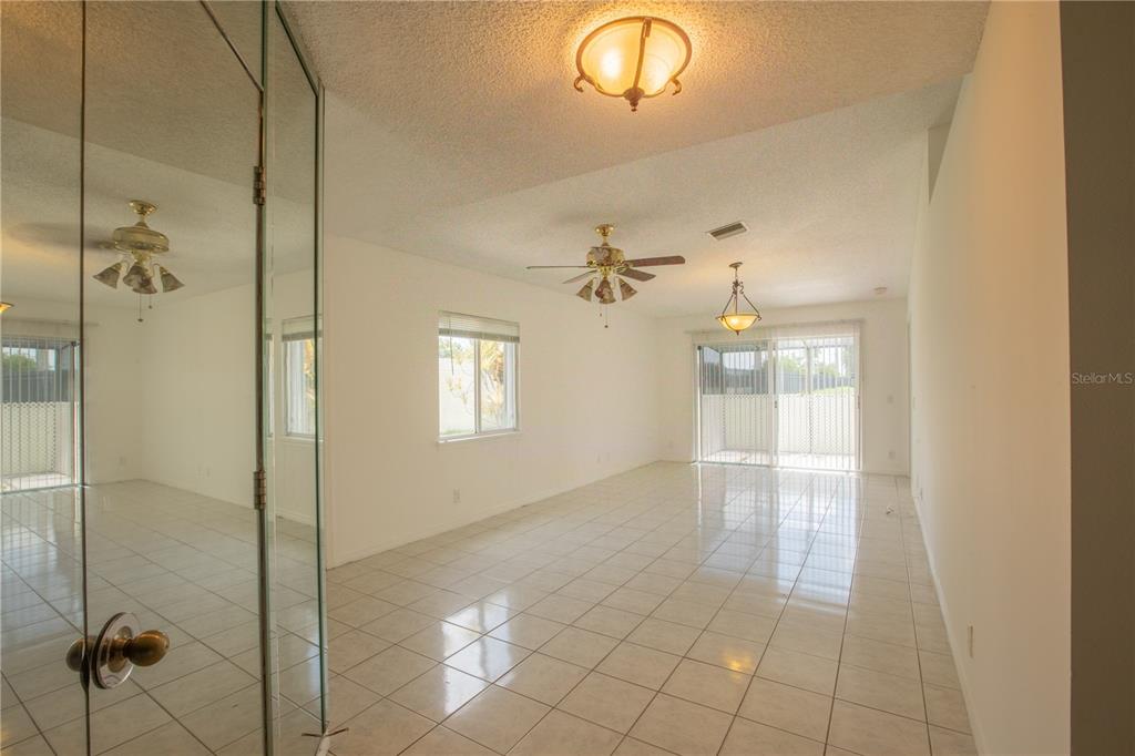 1711 Southwest 116th Way Miramar, FL 33025 - Photo 4 of 33 a bathroom with a glass shower door and a window