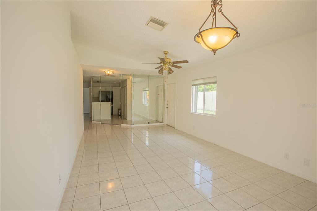 1711 Southwest 116th Way Miramar, FL 33025 - Photo 10 of 33 a view of a room with a chandelier fan and windows