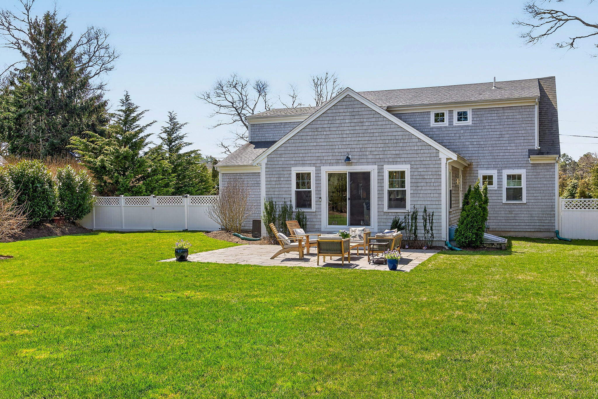 176 Bumps River Road Osterville, MA 02655 - Photo 40 of 54 a view of a house with backyard and sitting area
