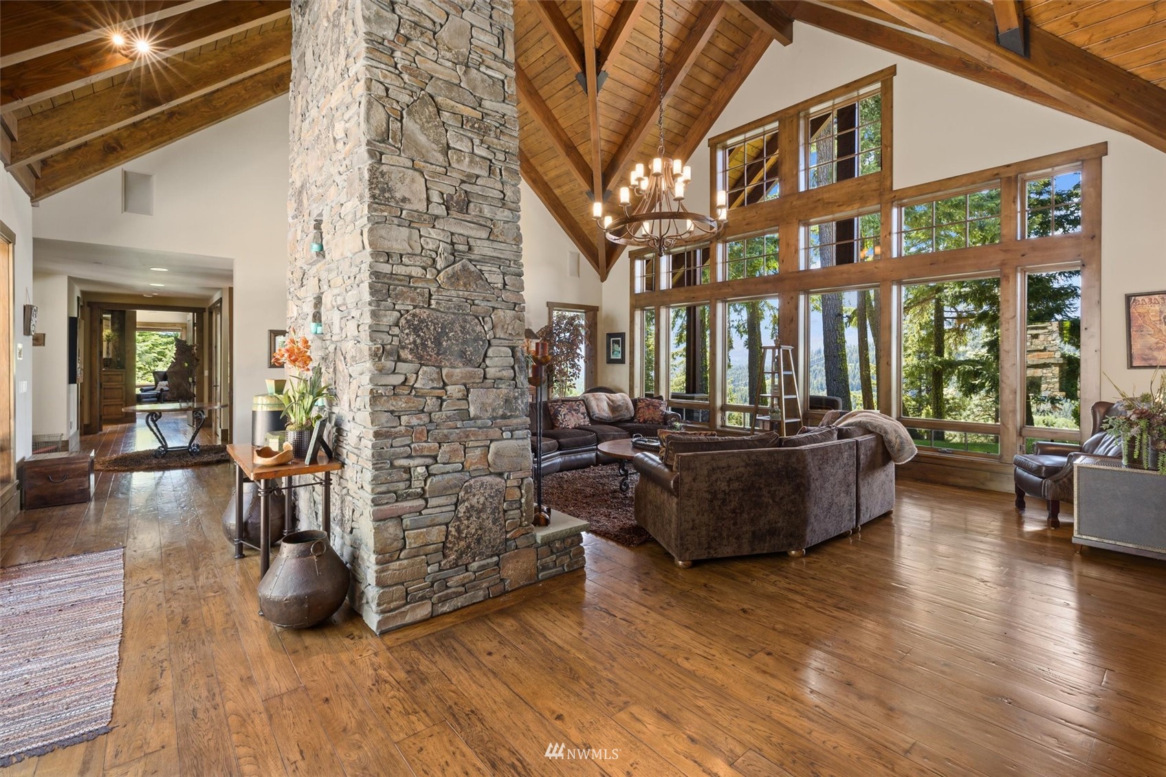 1650 Pinegrass Loop Cle Elum, WA 98922 - Photo 12 of 40 a living room with furniture a wooden floor and a large window