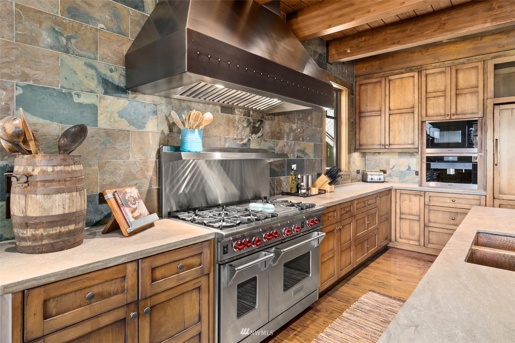 1650 Pinegrass Loop Cle Elum, WA 98922 - Photo 14 of 40 a kitchen with stainless steel appliances granite countertop a stove a sink and a microwave
