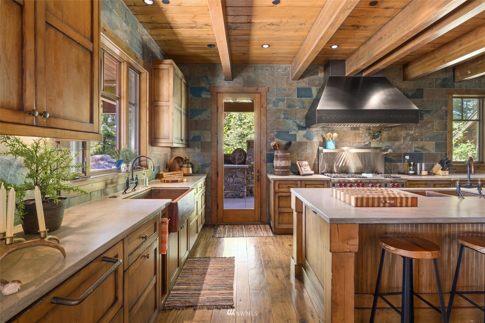 1650 Pinegrass Loop Cle Elum, WA 98922 - Photo 15 of 40 a kitchen with stainless steel appliances granite countertop a stove a sink and a refrigerator