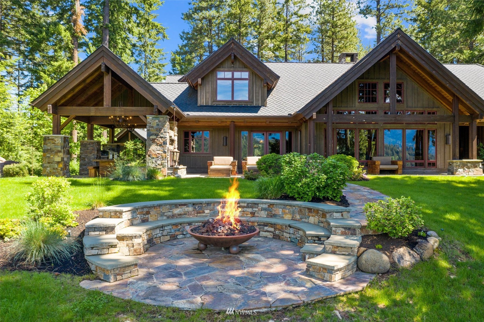 1650 Pinegrass Loop Cle Elum, WA 98922 - Photo 2 of 40 a front view of a house with a yard table and chairs