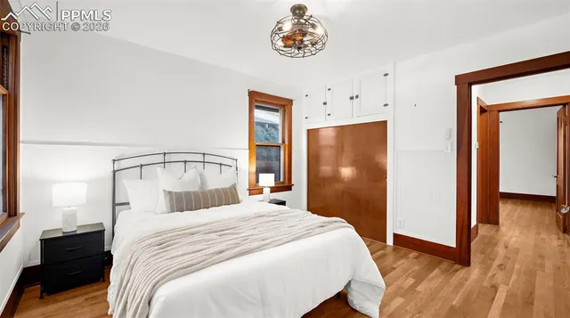 a bedroom with a bed and a view of bathroom