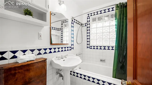 a bathroom with a sink and a bathtub