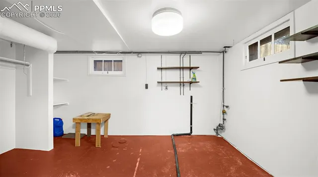 a bedroom with a bed and a chair