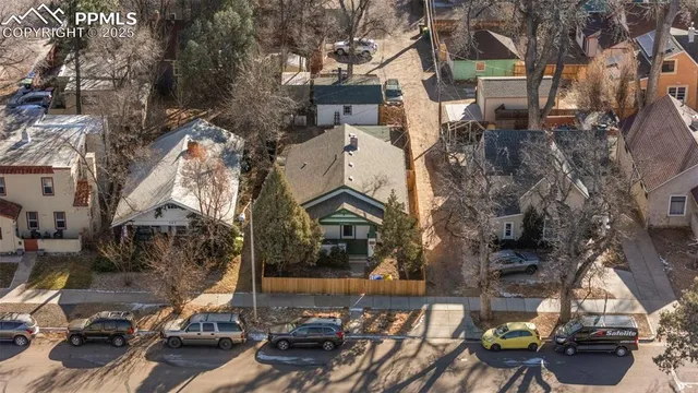 an aerial view of a house with sitting area and garden