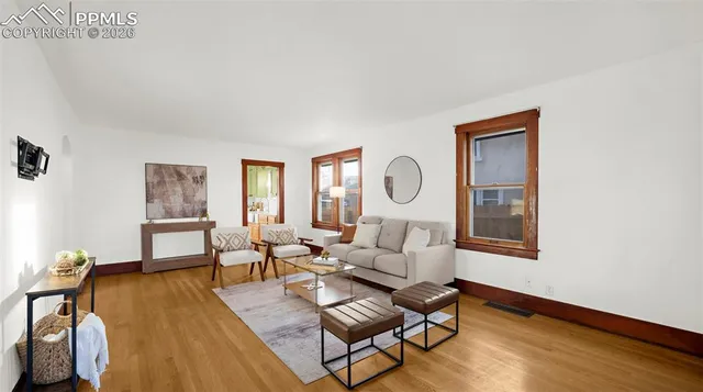 a living room with furniture and a window