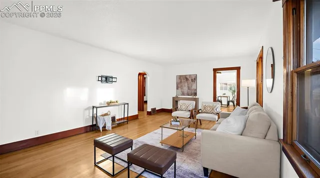 a living room with furniture and a table