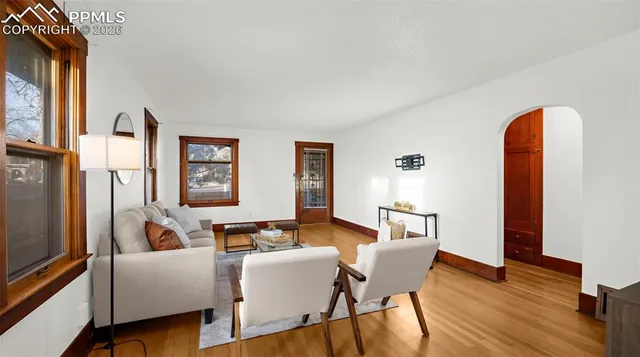 a living room with furniture and a window