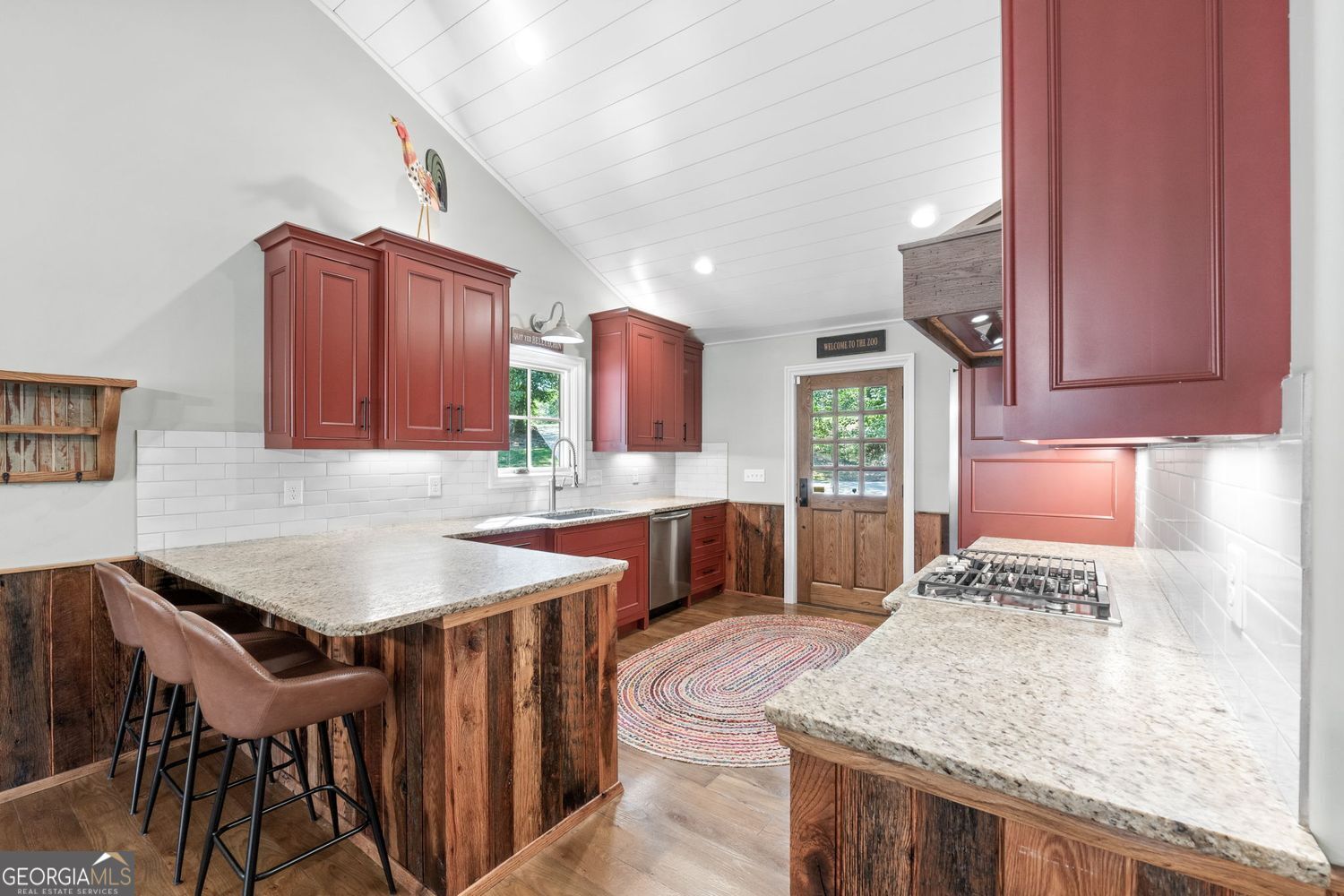 170 B Tater Hill Road Jackson, GA 30233 - Photo 15 of 74 a kitchen with a stove a sink and a wooden cabinets
