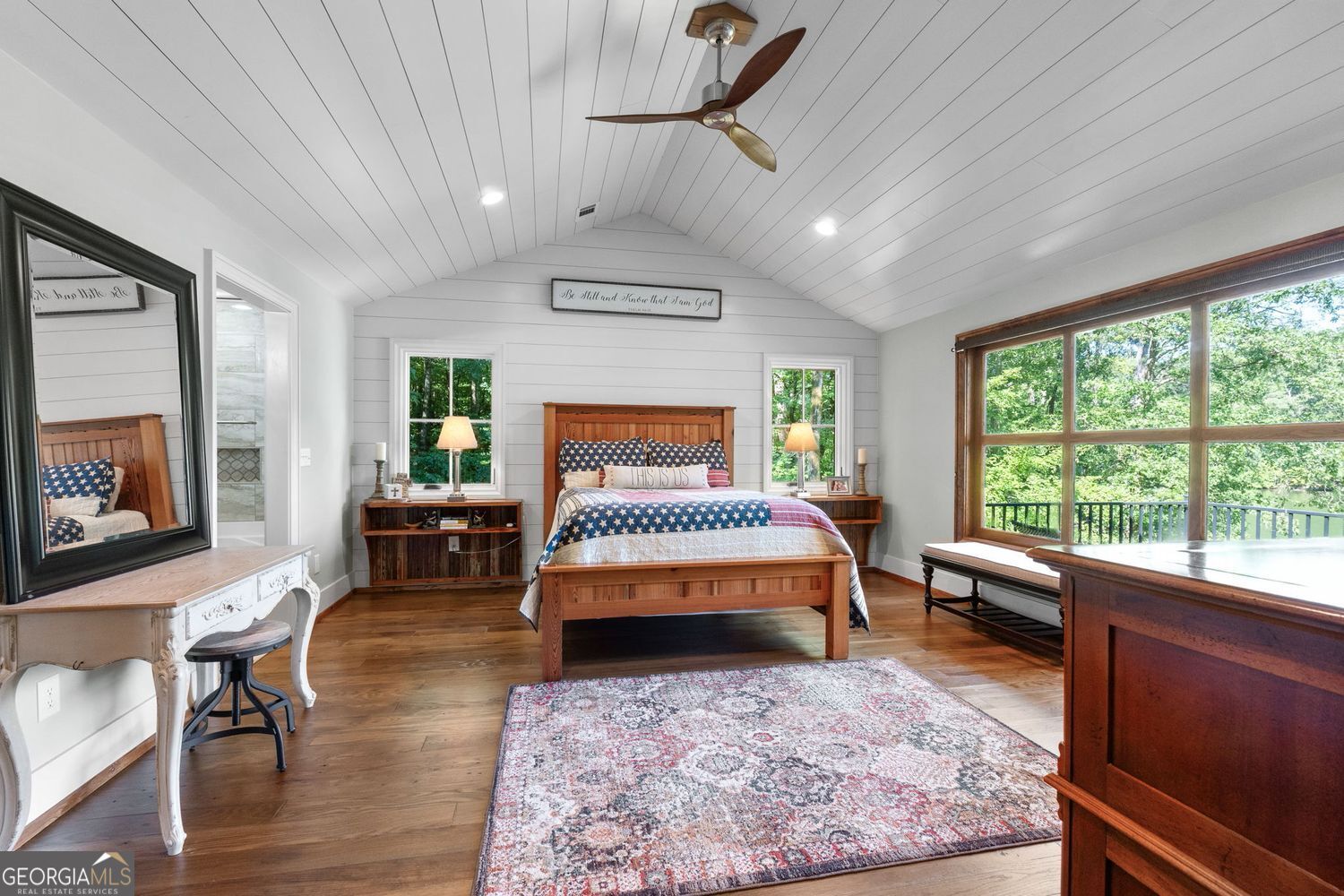 170 B Tater Hill Road Jackson, GA 30233 - Photo 28 of 74 a bedroom with a bed a table and chair with wooden floor