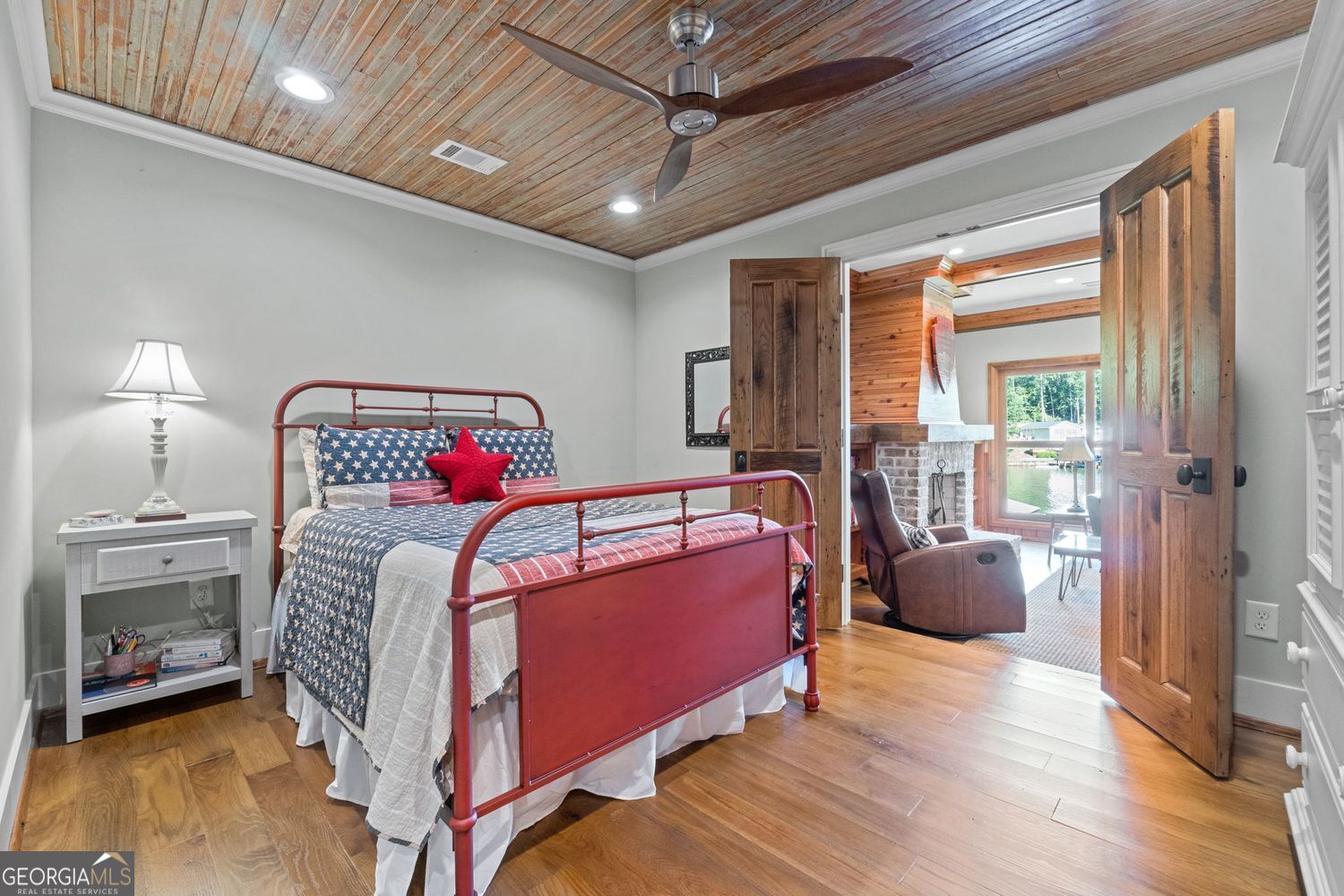 170 B Tater Hill Road Jackson, GA 30233 - Photo 36 of 74 a bedroom with a bed and a chandelier