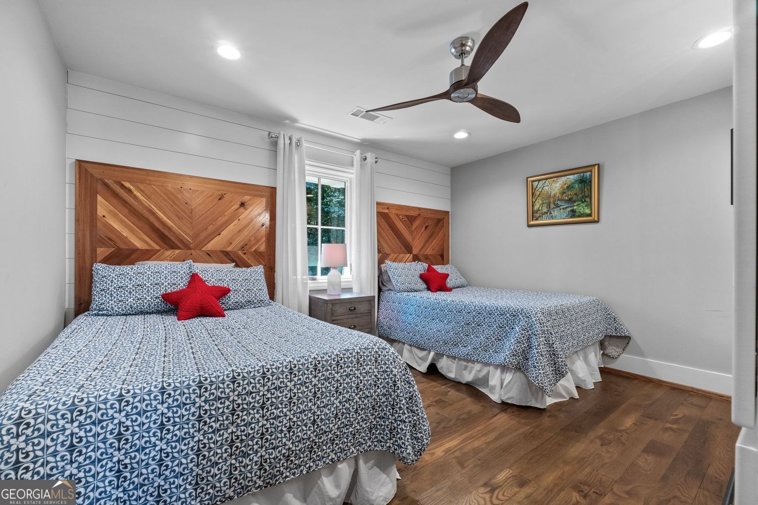 170 B Tater Hill Road Jackson, GA 30233 - Photo 39 of 74 a bedroom with a large bed and a chandelier