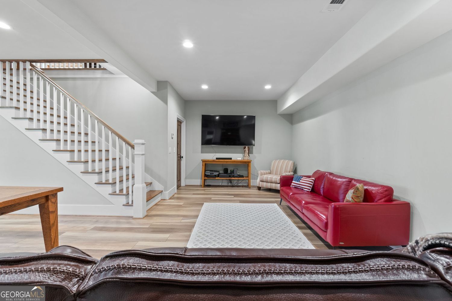 170 B Tater Hill Road Jackson, GA 30233 - Photo 42 of 74 a living room with furniture and a flat screen tv