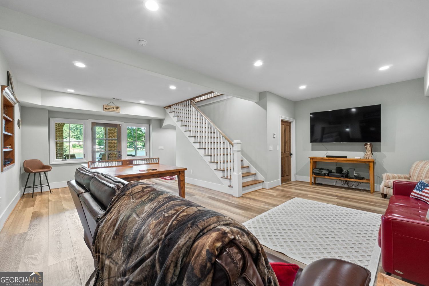 170 B Tater Hill Road Jackson, GA 30233 - Photo 44 of 74 a living room with furniture and a flat screen tv