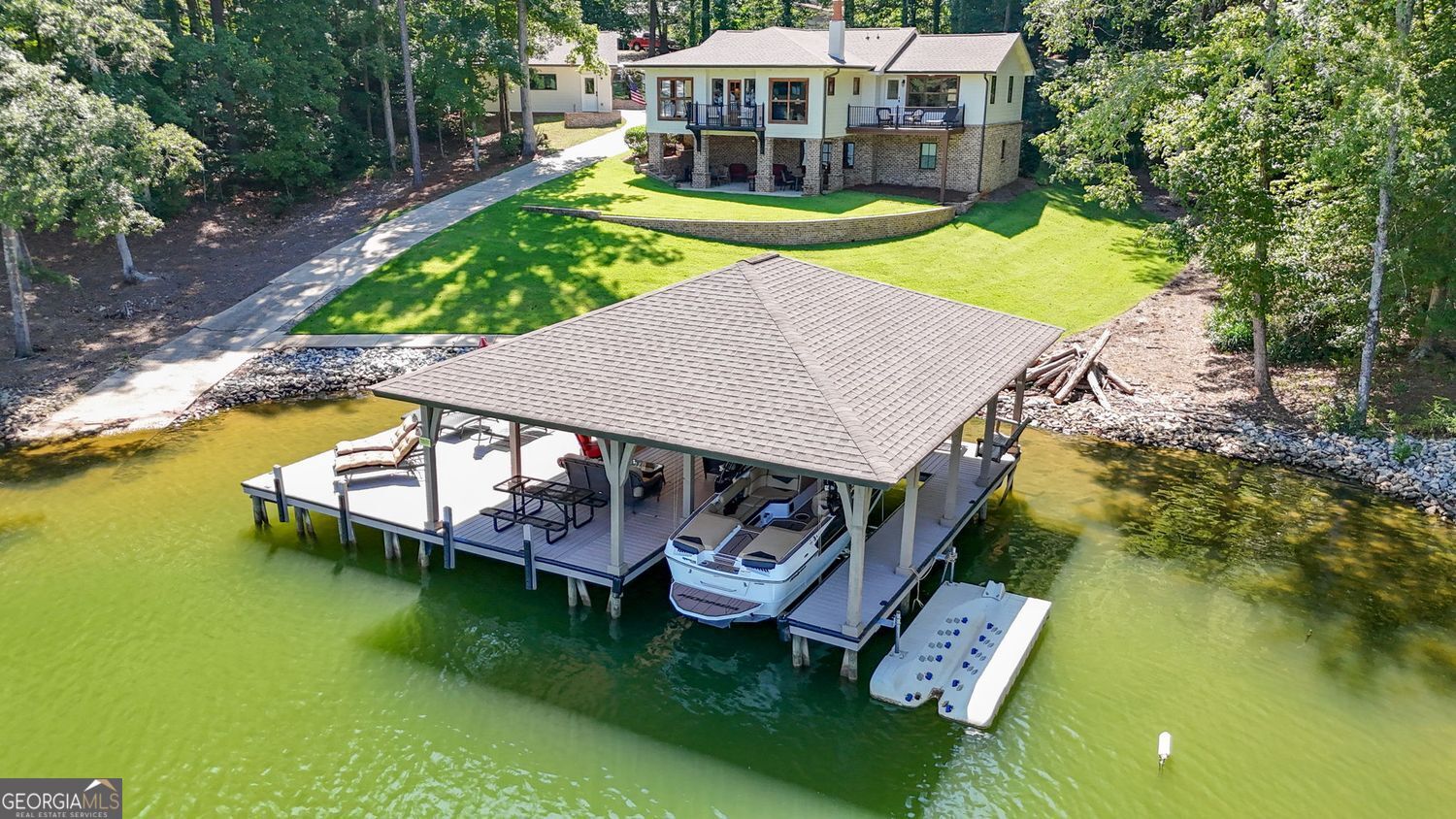 170 B Tater Hill Road Jackson, GA 30233 - Photo 5 of 74 a view of a house with pool and chairs next to a yard