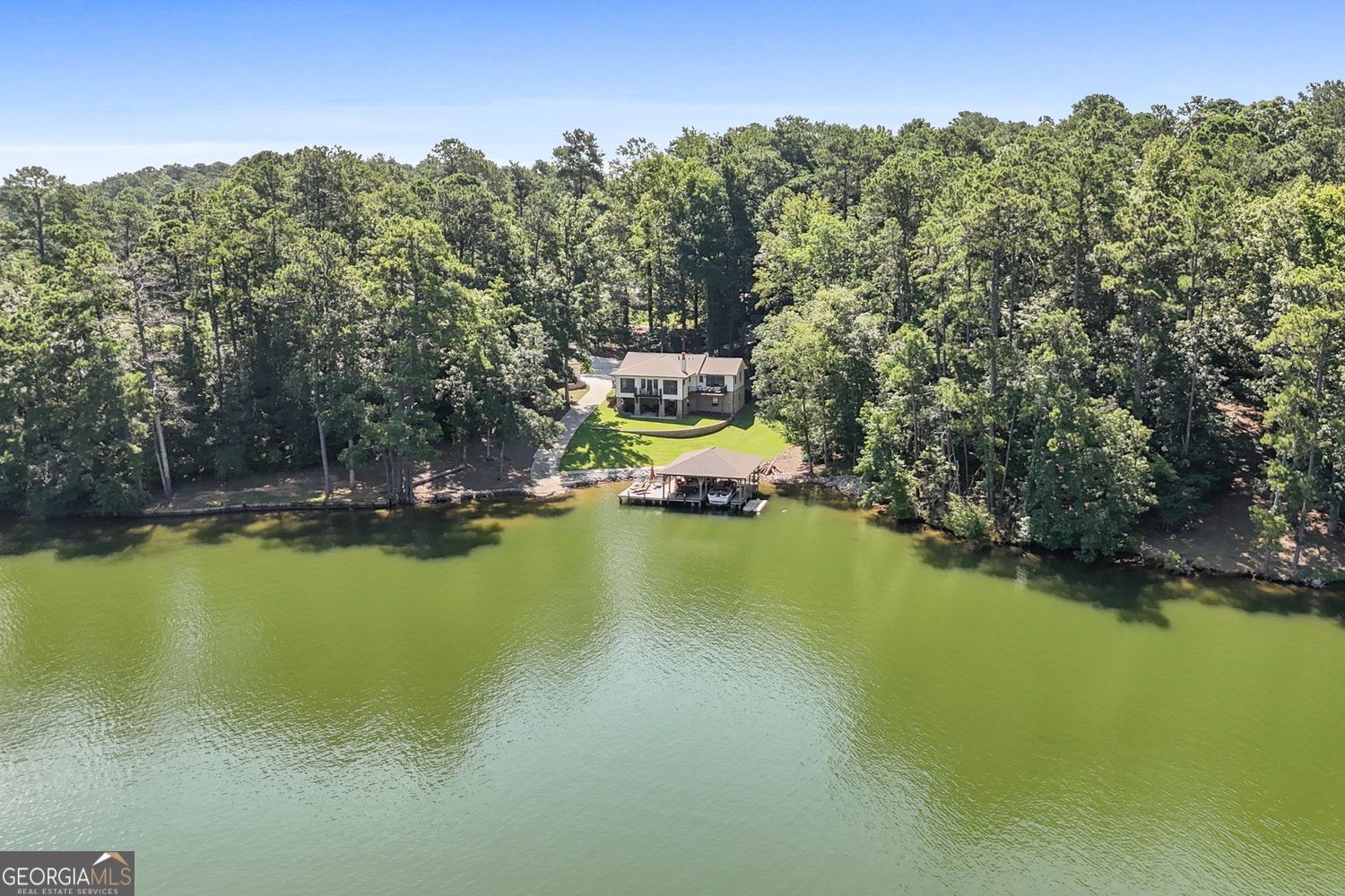 170 B Tater Hill Road Jackson, GA 30233 - Photo 6 of 74 a view of a swimming pool with an outdoor space and seating area