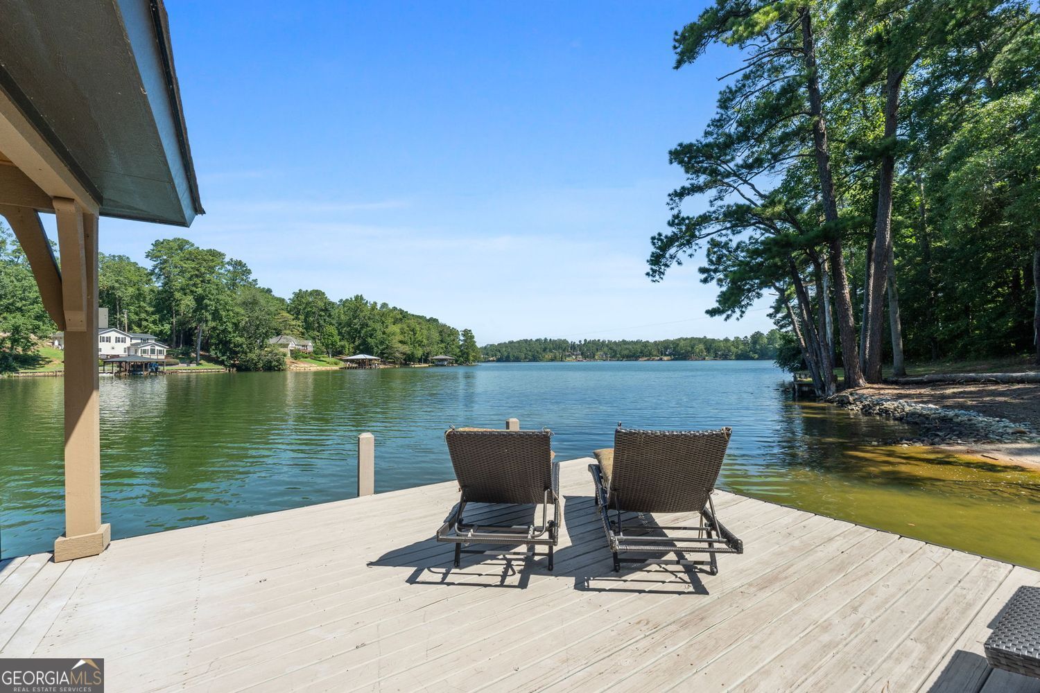170 B Tater Hill Road Jackson, GA 30233 - Photo 69 of 74 a view of a lake with a table and chairs in the patio