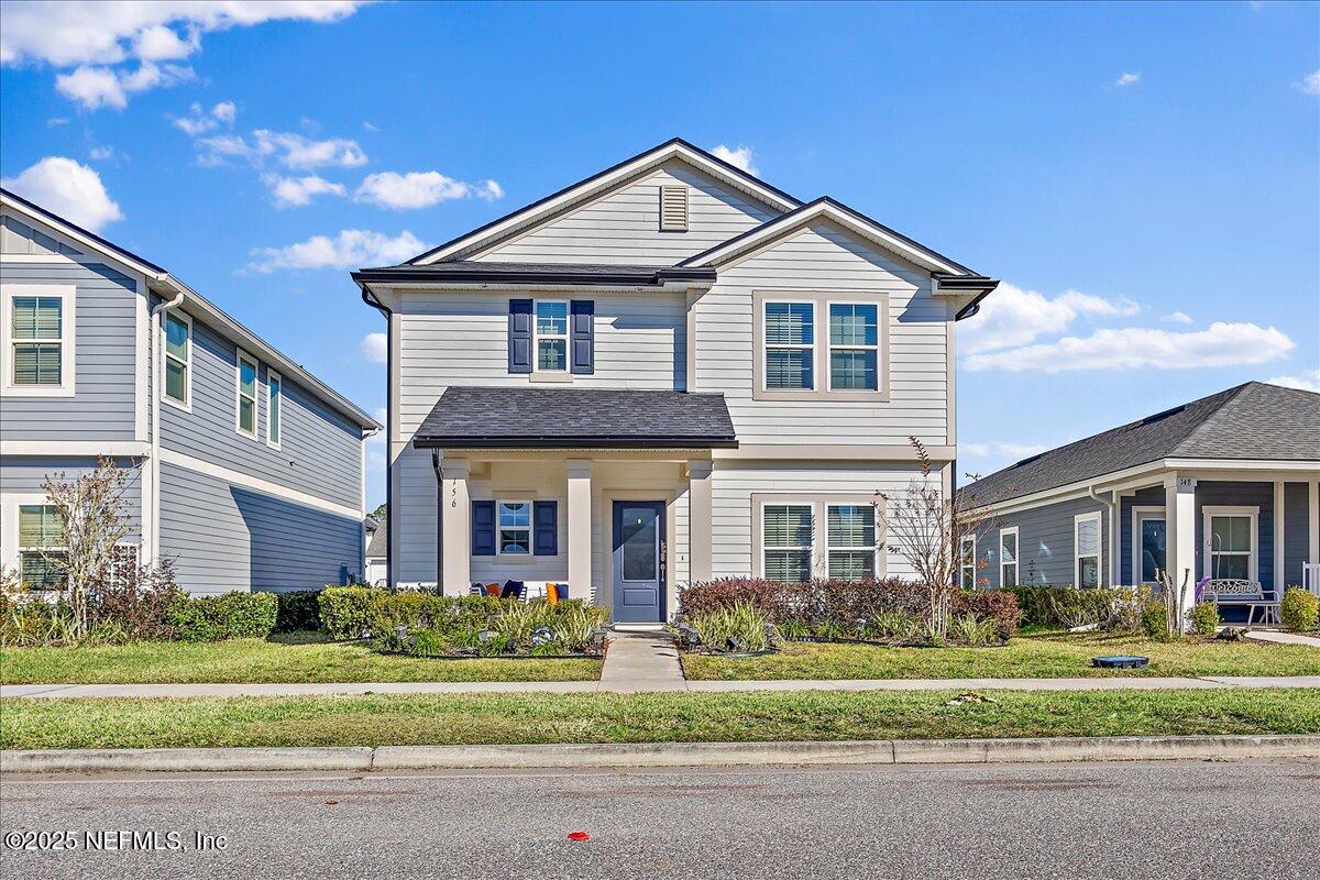 156 Clarys Run St. Augustine, FL 32092 - Photo 1 of 20 a front view of a house with a yard