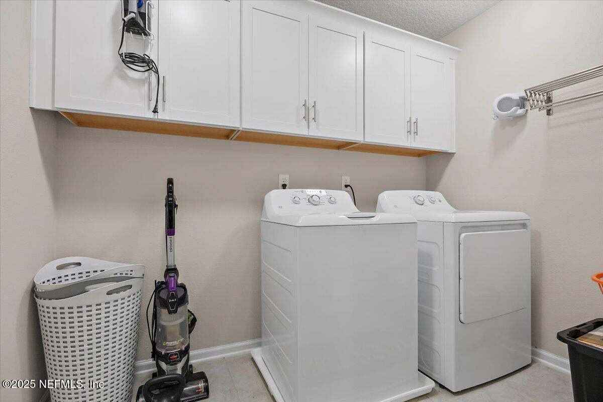 156 Clarys Run St. Augustine, FL 32092 - Photo 14 of 20 a utility room with dryer and washer