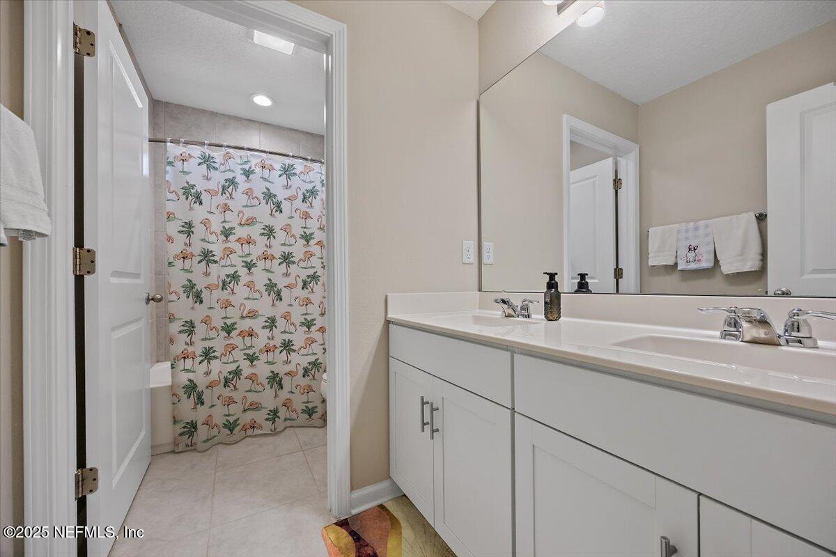 156 Clarys Run St. Augustine, FL 32092 - Photo 16 of 20 a bathroom with a sink and a mirror