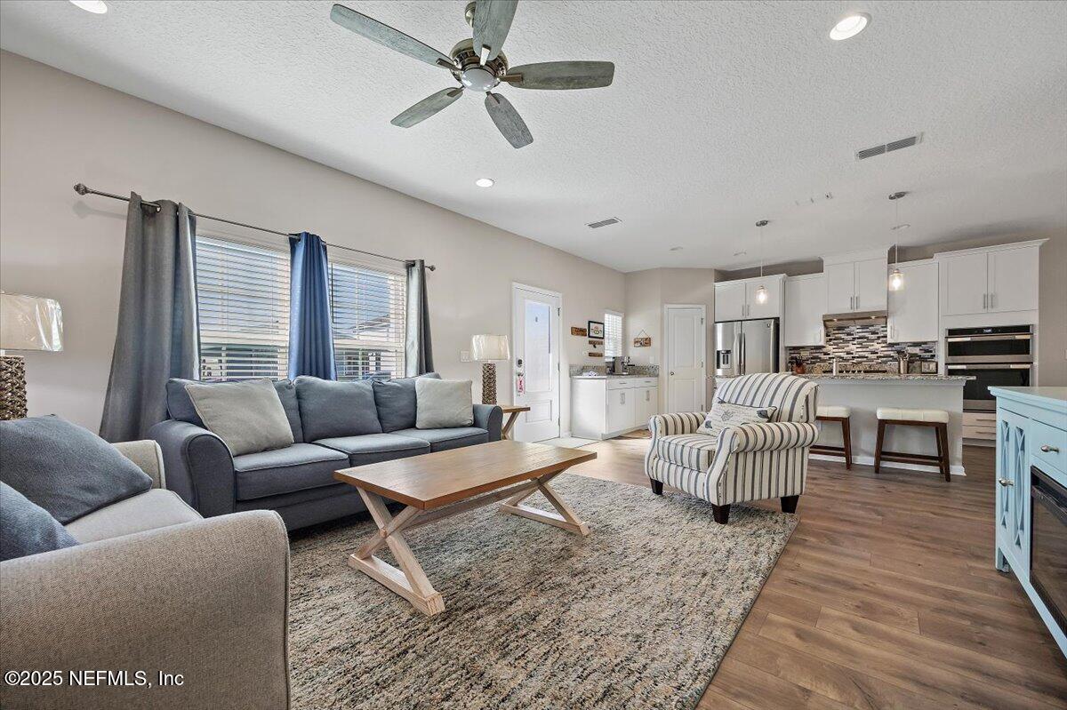 156 Clarys Run St. Augustine, FL 32092 - Photo 4 of 20 a living room with furniture and a large window