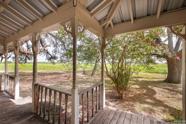 a view of a porch with wooden floor and outdoor space