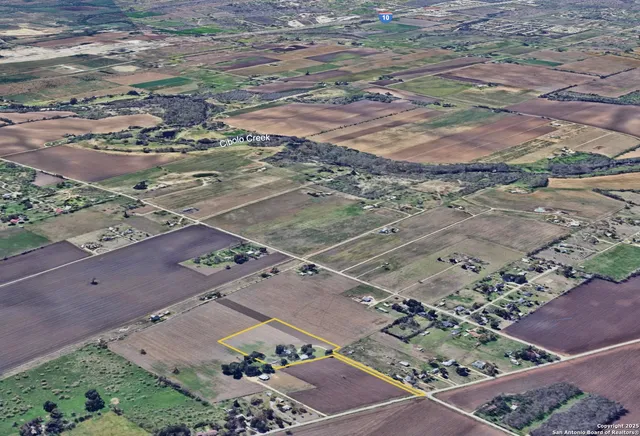an aerial view of a house with a garden