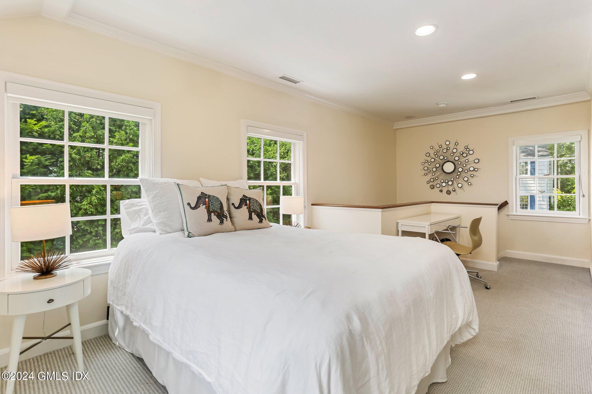 7 Wesskum Wood Road Riverside, CT 06878 - Photo 20 of 29 a bedroom with a large bed and a window