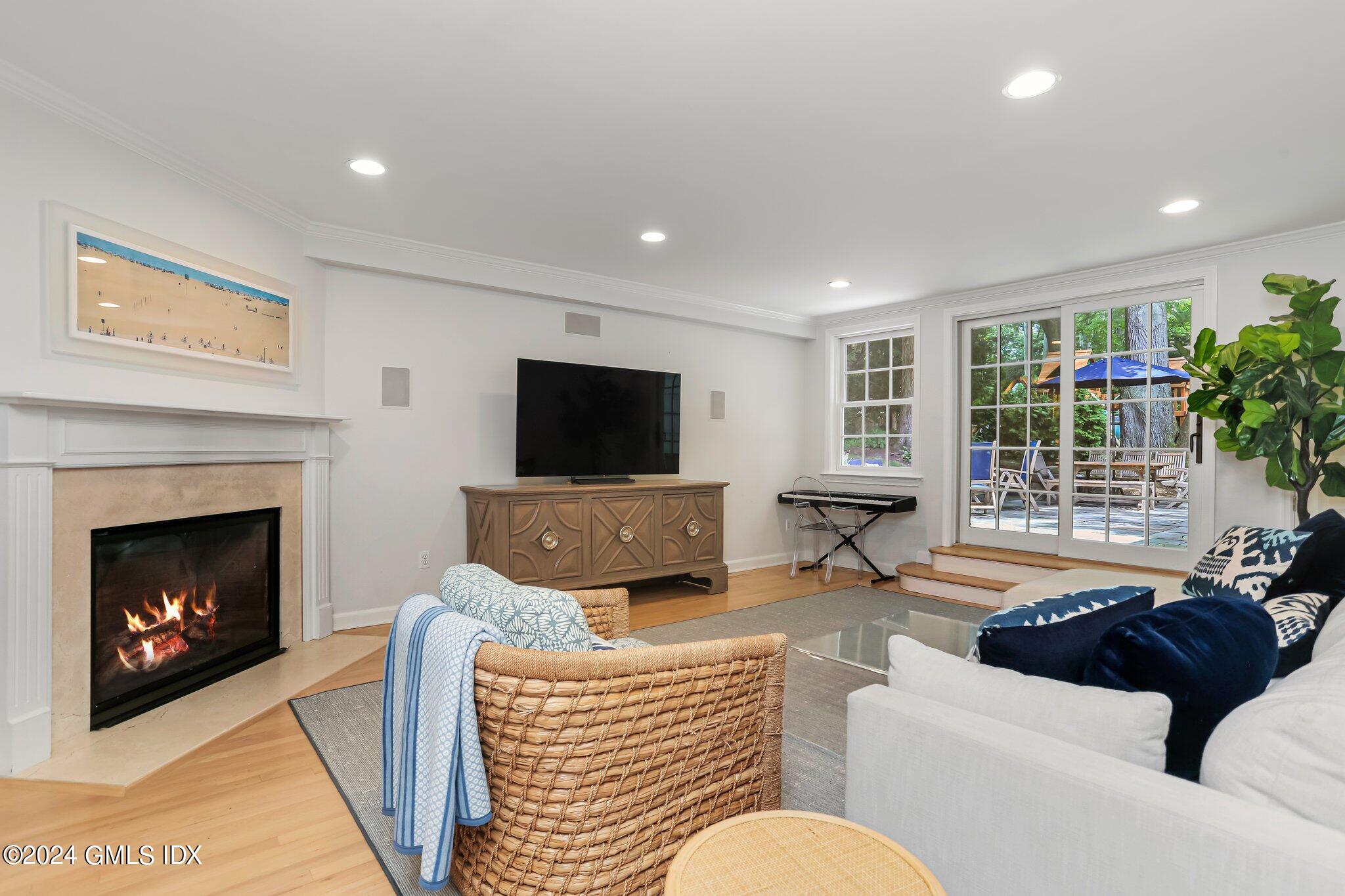 7 Wesskum Wood Road Riverside, CT 06878 - Photo 22 of 29 a living room with furniture and a fireplace