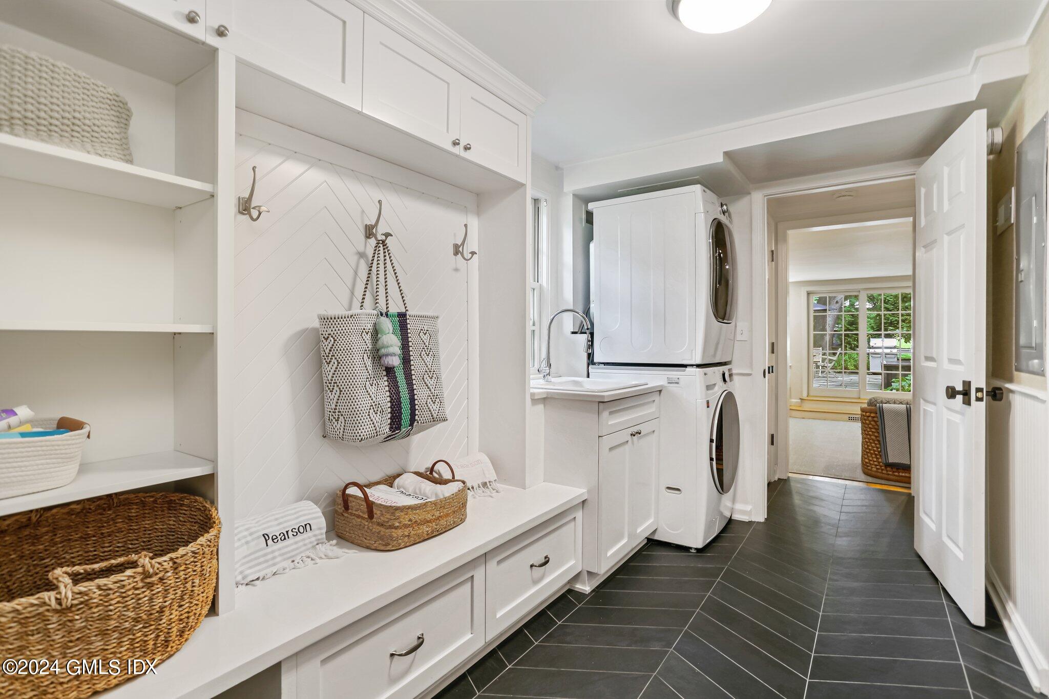 7 Wesskum Wood Road Riverside, CT 06878 - Photo 25 of 29 a hallway with white cabinets and wooden floor