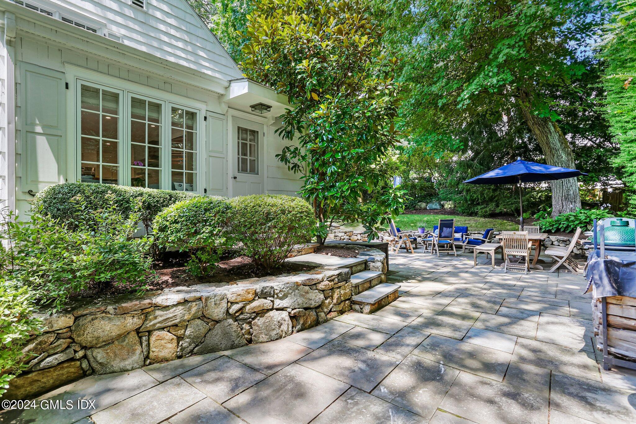 7 Wesskum Wood Road Riverside, CT 06878 - Photo 26 of 29 a view of backyard with outdoor seating and barbeque oven