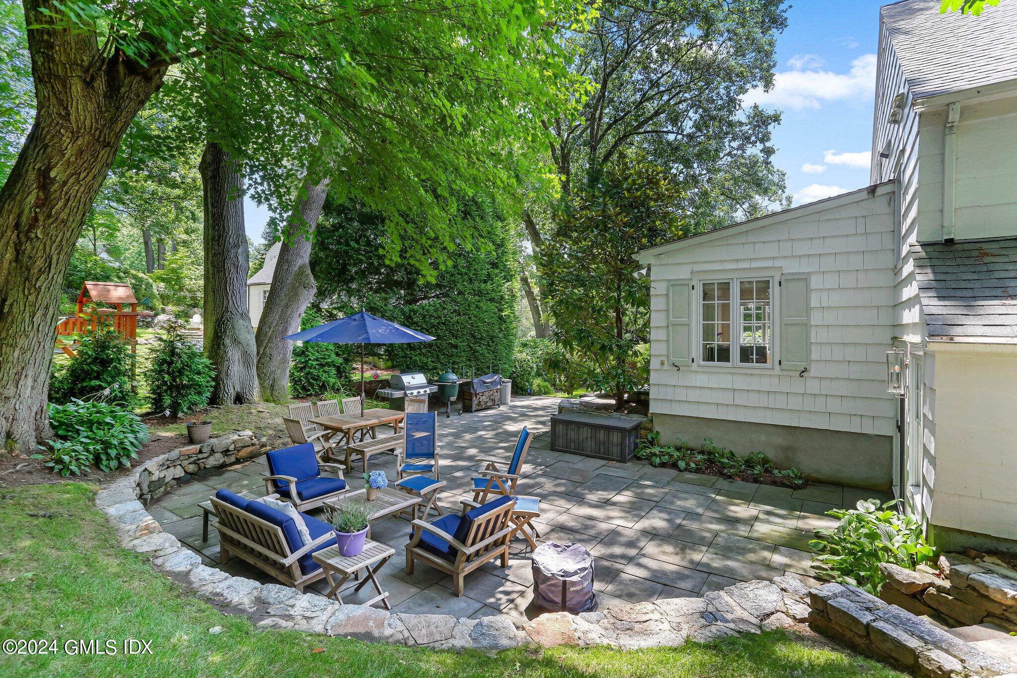 7 Wesskum Wood Road Riverside, CT 06878 - Photo 27 of 29 a view of a backyard with sitting area