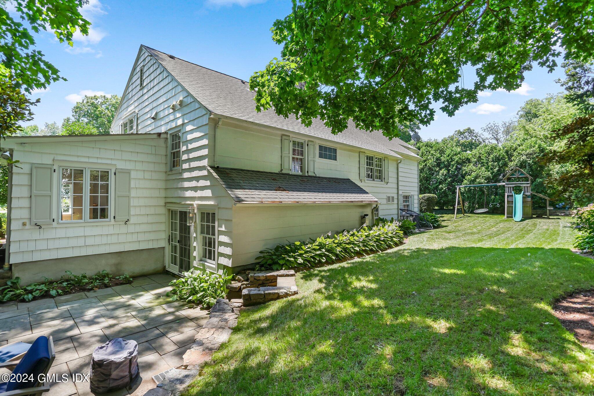 7 Wesskum Wood Road Riverside, CT 06878 - Photo 29 of 29 a front view of a house with garden