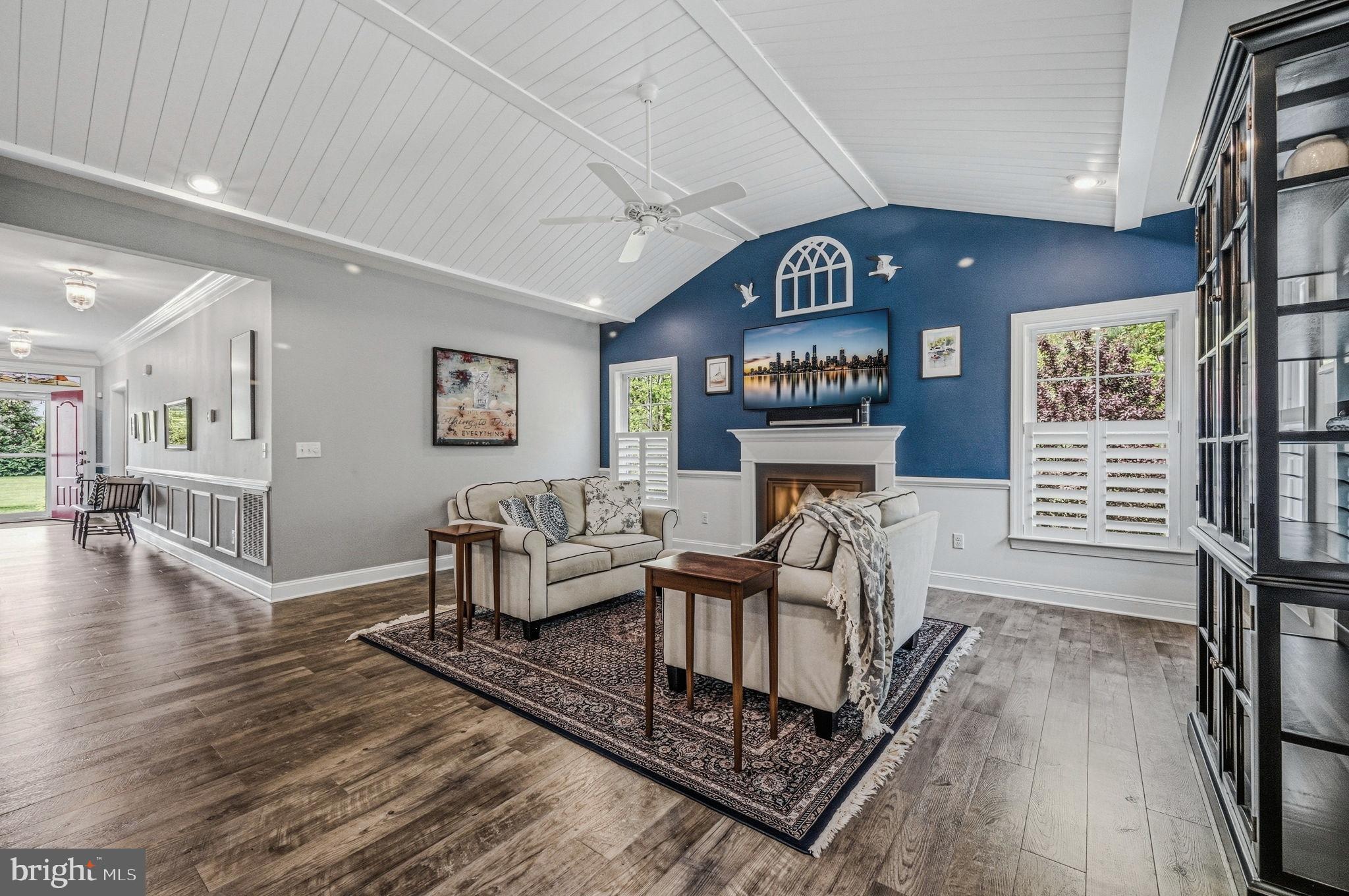 26578 Spring Haven Road Milton, DE 19968 - Photo 15 of 44 Family room featuring shiplap ceiling, gas firepla