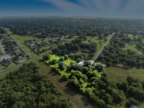 an aerial view of residential house with outdoor space