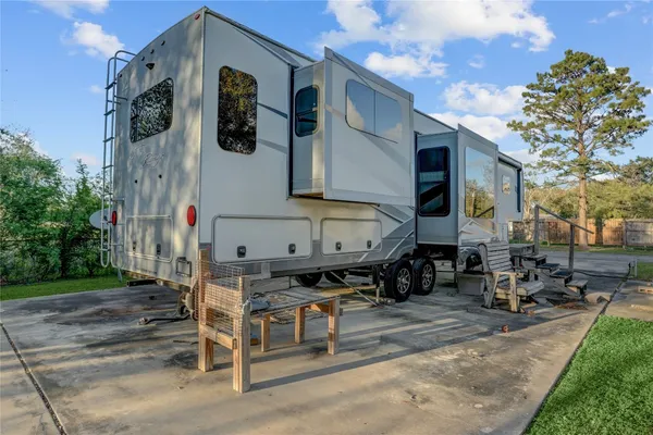 a row of table and chairs in front of building