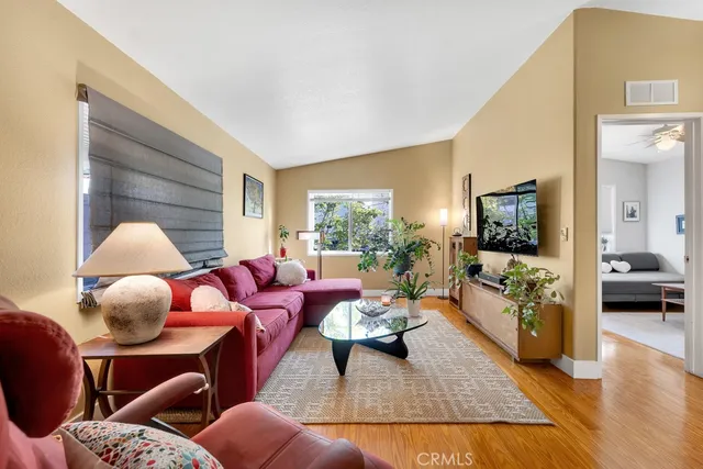 a living room with furniture fireplace and a flat screen tv