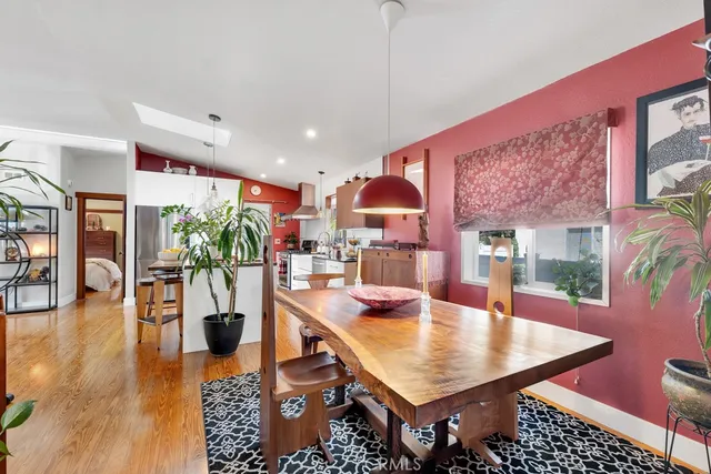 a dining room with furniture and wooden floor
