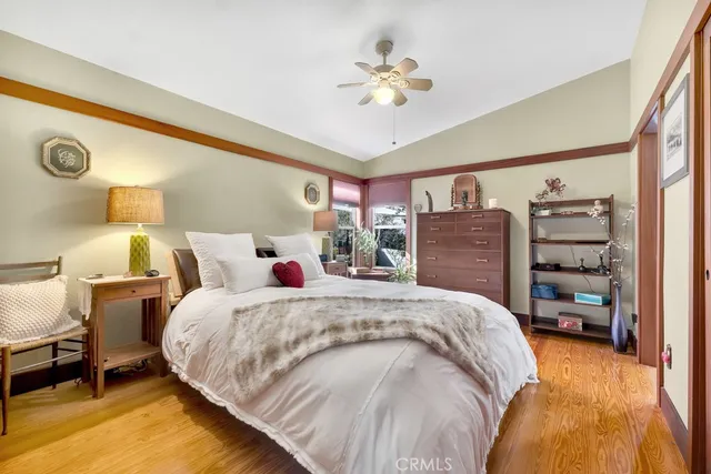 a bed room with a bed and a chandelier