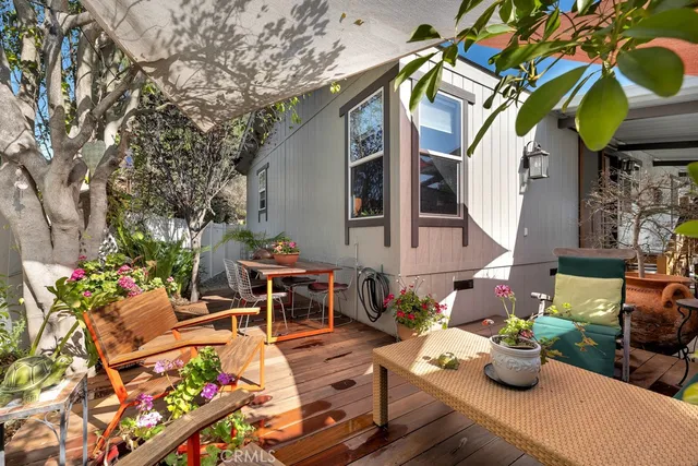 a view of a chairs and table in the patio