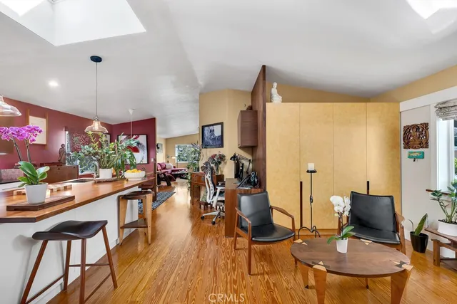 a view of a dining room with furniture and a livingroom