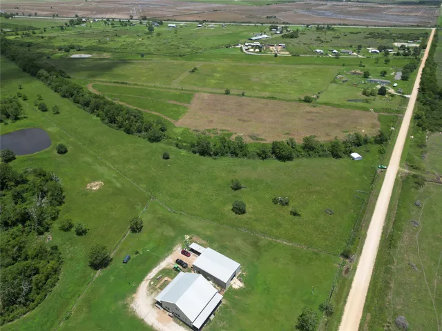 a view of a field with an trees