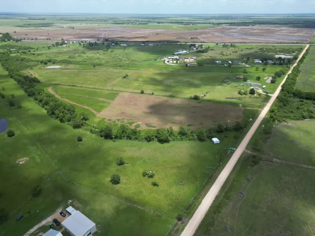 a view of a field with an ocean