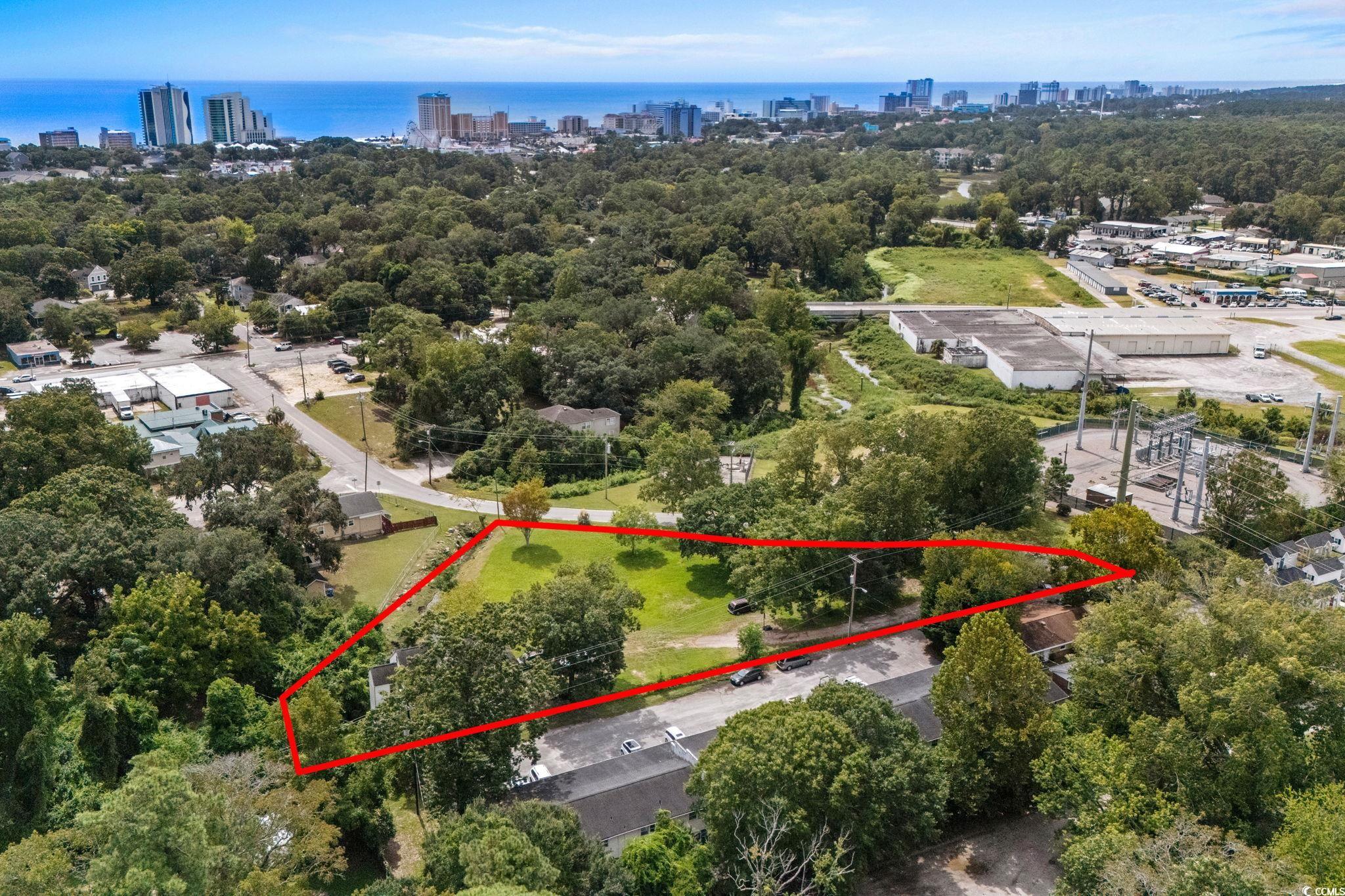 904 3rd Avenue North Myrtle Beach, SC 29577 - Photo 15 of 26 View of urban area with property boundaries highlighted and a tree filled landscape