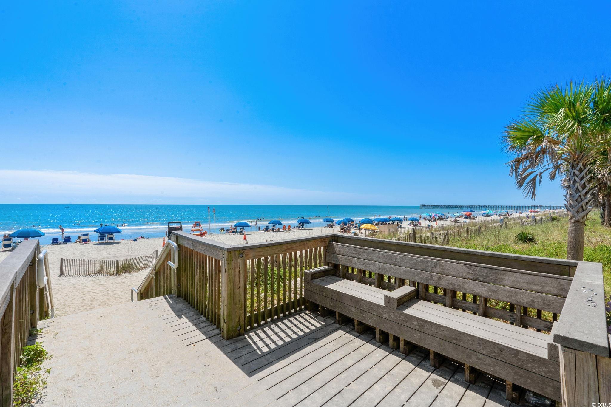 904 3rd Avenue North Myrtle Beach, SC 29577 - Photo 23 of 26 Deck with view of water and beach