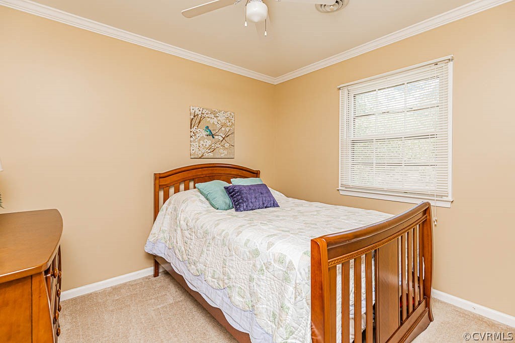 10801 Belvoir Road Chester, VA 23831 - Photo 18 of 23 a bedroom with a bed and a window