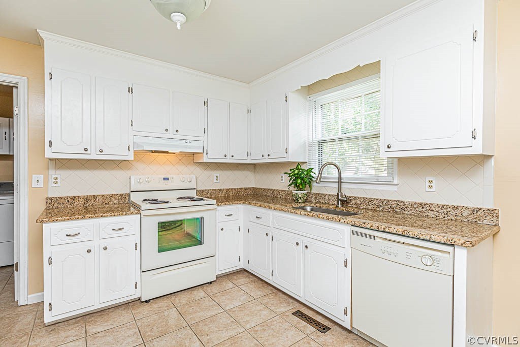 10801 Belvoir Road Chester, VA 23831 - Photo 9 of 23 a kitchen with cabinets appliances a sink and a window