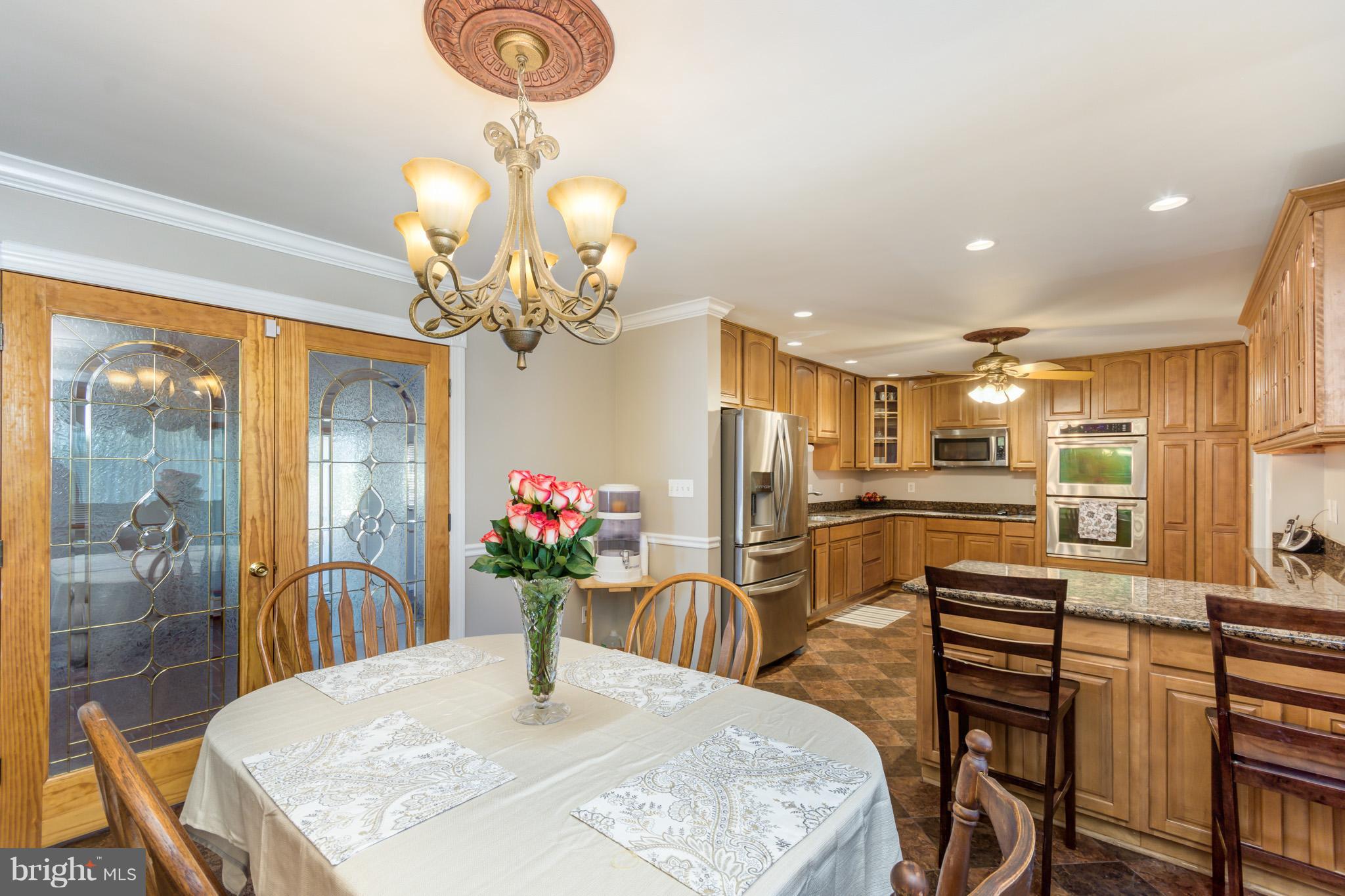 1107 Green Acre Road Baltimore, MD 21286 - Photo 12 of 30 Dining Room Open To Kitchen W/ Breakfast Bar